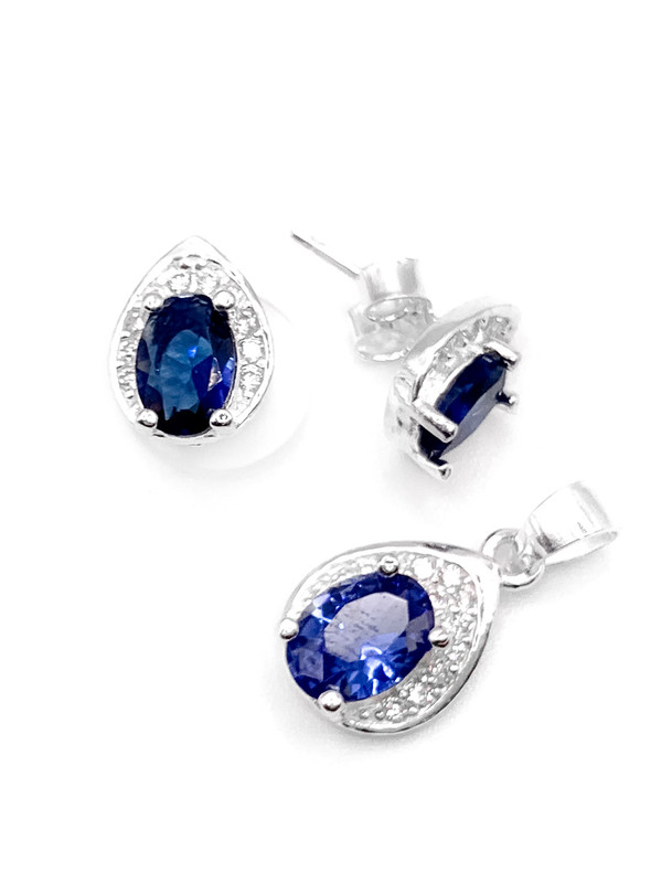 Juegos plata ovalado con circon azul a presion