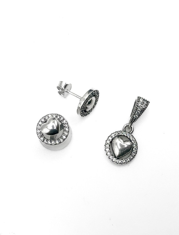 Juegos plata circulo con corazon movible a presion